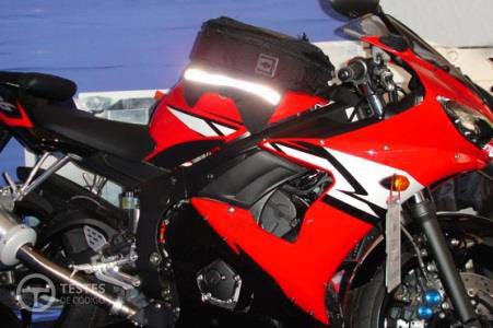 Pergunta IMT: Na condução de motociclos, a presença de gasóleo derramado na via, pode: